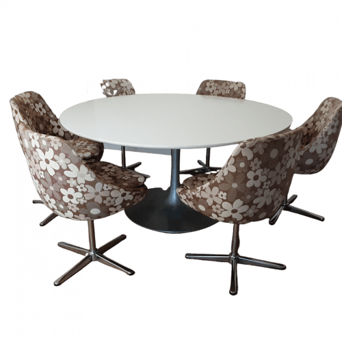 Tulip dining table with six egg swivel dining chairs