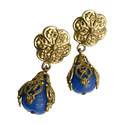 A pair of vintage 1950s French couture-made drop earrings. A large cornflower blue pear-shaped, Gripoix, poured glass drop is set in a gold-plated filigree cap