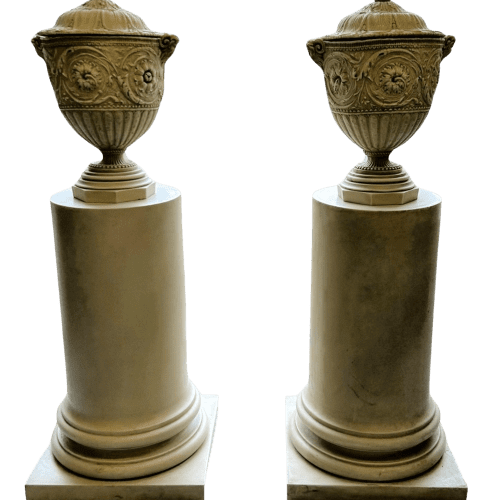 A Pair of Decorative Pedestals with Lidded Urns