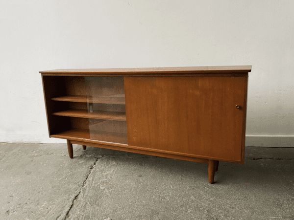 Mid-Century teak bookcase by Avalon with sliding doors